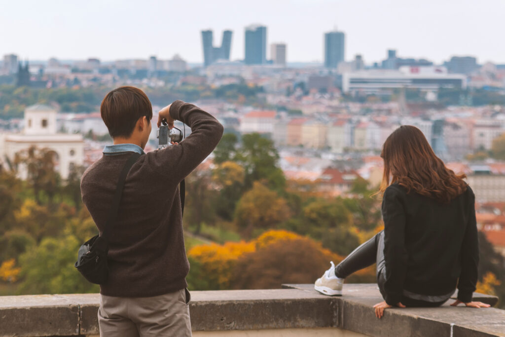 Nice couple taking pictures and enjoying city view